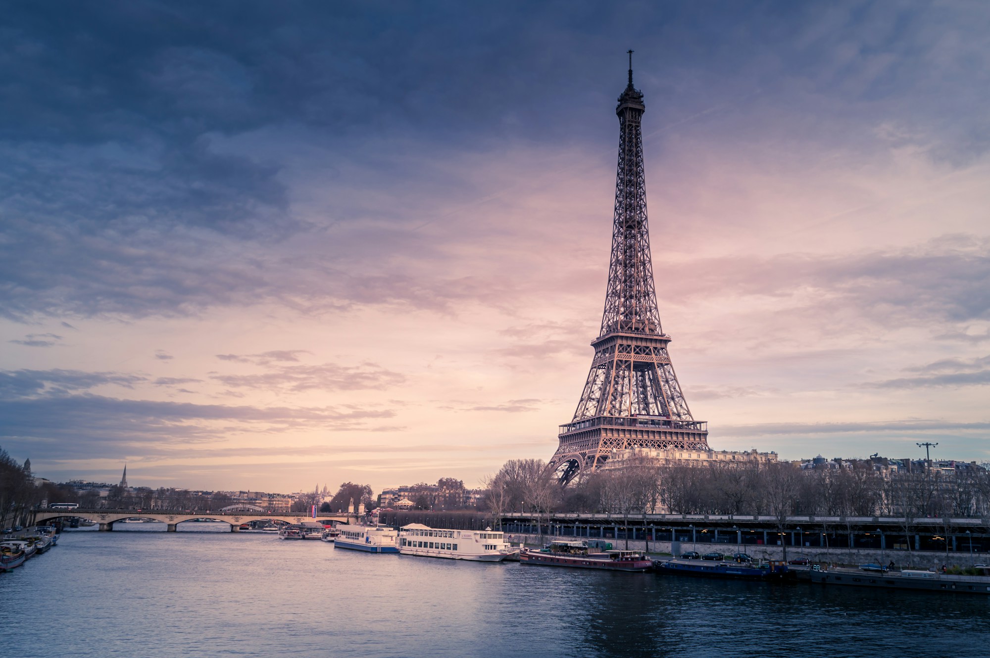 Paris rooftops and the Eiffel Tower at sunset
